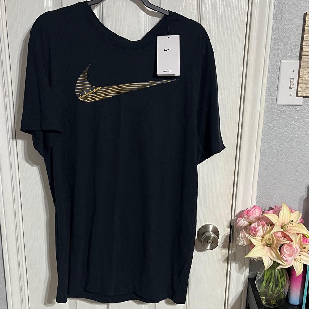 Nike Men's Black Tee with Gold Swoosh
